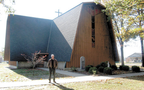 John Black, whose father helped found the parish in 1949, stands in front of St. Joseph the Worker Church, facing north at 1415 Harb Street in Corning.