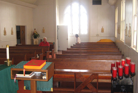John Hunter Taaffe and his sister, Mary Taaffe Board, are seen in the back pews in this view from behind the ambo. Sacred Heart parishioners have sat in these same pews for nearly 60 years.