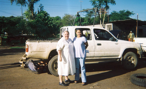 Sister Laura Cathcart, OSB, poses with Martha Baldizon, a member of her Nicaraguan host family, in June. The Benedictine sister has visited Central America for the past four summers.