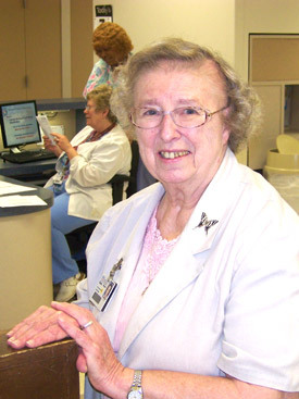 Sister Margaret Meisner, SCN, stops by one of the nurse's stations at St. Vincent Infirmary Medical Center in Little Rock.