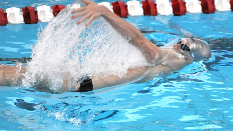 Sam Olson competes in the 100-yard backstroke at the high school state championship in March 2010. His third-place finish qualified him for the Junior Nationals.