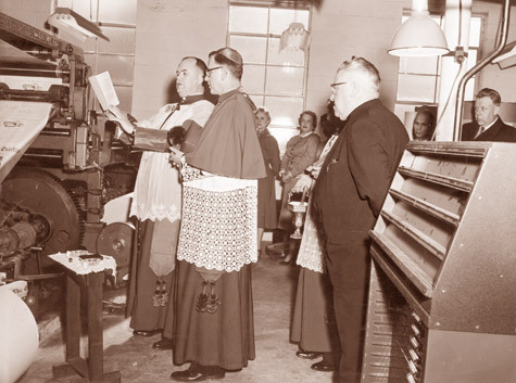 Bishop Albert L. Fletcher blesses the new Twin Goss Press Unit on the feast of St. Francis de Sales, the patron of journalists, Jan. 29, 1955. He used official prayers for blessing a printing office and printing press.