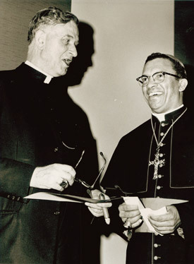 Bishop Albert L. Fletcher talks with the new Auxiliary Bishop of New Orleans Harold R. Perry, S.V.D. The Guardian reported Bishop Fletcher attended Perry's consecration rite on Jan. 6, 1966, at St. Louis Basilica in New Orleans.