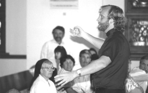 Father Scott Friend, diocesan Hispanic ministry directory, teaches the Gospel in Spanish at St. Edward Church in Texarkana in October 1989.