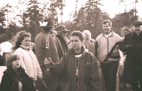Kari Kemmerer, representing the Catholic youth of the diocese, holds the sesquicentennial torch at the opening ceremonies Nov. 27, 1993, at St. John Center in Little Rock. Moments later, she passed the torch to Clare Wolf of Prairie View, who lit the sesquicentennial flame. Fifty runners, representing different parishes in the diocese, carried the torch in one-mile increments along its eight-hour, 50-mile journey from Plum Bayou.