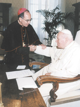 Bishop J. Peter Sartain greets Pope John Paul II during his first "ad limina" visit to the Vatican in 2004. The bishop's audience with the pope was scheduled for May 18, the pope's 84th birthday.
