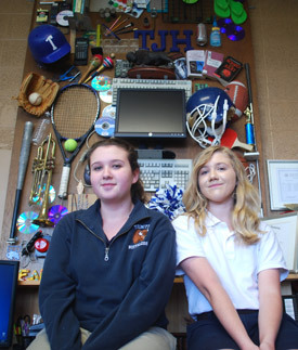 Payton Griffith and Caitlin Tusing helped create this relief sculpture made from "found objects" to represent all aspects of Trinity Junior High School in Fort Smith.
