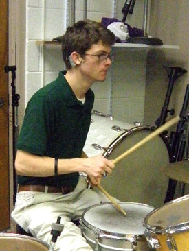 Senior Mitchell Moore practices his drumming after school in the band room at Catholic High School in Little Rock.