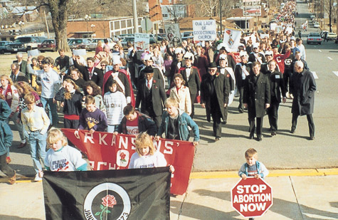 Bishop Andrew J. McDonald walks at the head of the Arkansas March for Life in 1989, as he did from the first march in 1978.