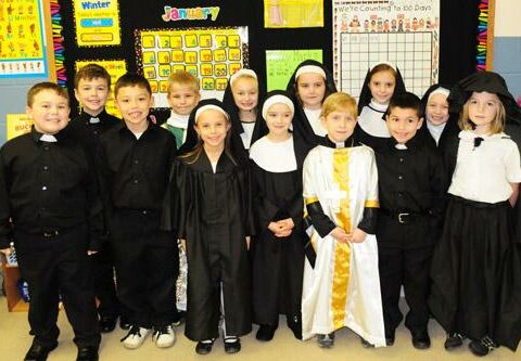 During a Catholic Schools Week open house at St. Vincent de Paul School in Rogers Jan. 29, 2012, the first and second graders put on a program documenting the history of Catholic schools in Arkansas.