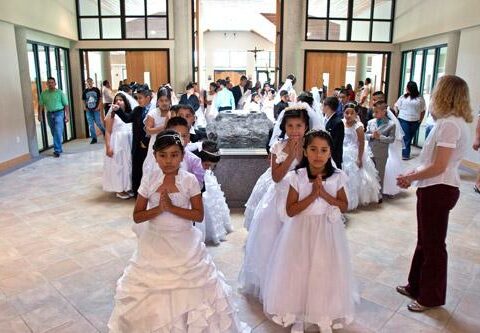 Most Hispanic children, like these girls at their first Communion Mass at St. Vincent de Paul Church in Rogers May 19, 2012, are born in the United States, but often one or both of their parents were born in Latin America.