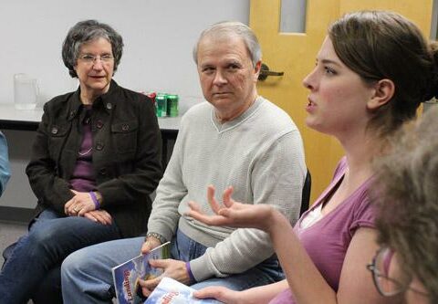 Team leaders Rosemary Kraft (left) and her husband David listen as Landings member Hannah Pfaff of Cabot shares a point during a recent meeting at St. Anne Church in North Little Rock.