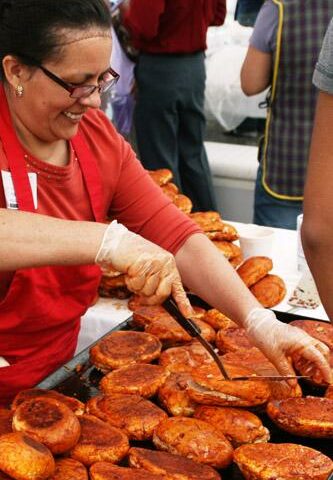 Josefina Fonseca of St. Vincent de Paul Church in Rogers grills pambazos during the 2012 parish festival. Organizers expect to go through 1,200 of the tasty Mexican sandwiches for the 2013 event.