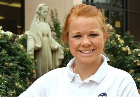 Madeline Whitacre, Mount St. Mary Academy class of 2014, pauses outside the Little Rock school.