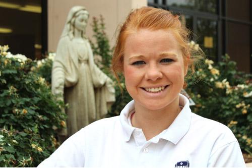 Madeline Whitacre, Mount St. Mary Academy class of 2014, pauses outside the Little Rock school.