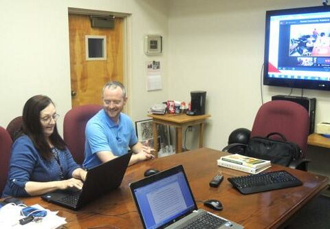 Subiaco Academy Headmaster Matt Stengel (right) and Julie Rochester, principal of St. Joseph School in Paris, attend a virtual distance learning class through St. Louis University April 18 at Subiaco.