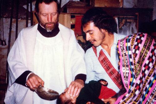 Father Stanley Rother, a priest of the Oklahoma City Archdiocese who was brutally murdered in 1981 in the Guatemalan village where he ministered to the poor, is shown baptizing a child in this undated photo.