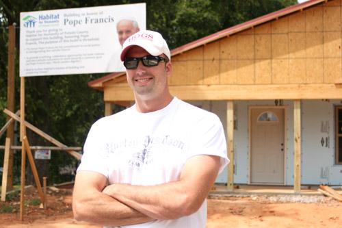 Luke Stovall, 30, founder of the Catholic Young Professionals Service Organization, has helped work on the Pope Francis House, a project by Habitat for Humanity of Pulaski County with help from Catholic Charities of Arkansas.