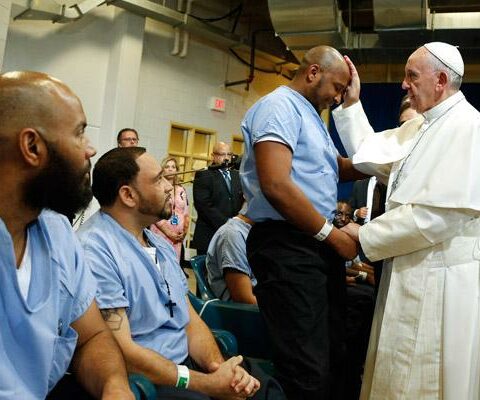 Pope Francis blesses a prisoner as he visits the Curran-Fromhold Correctional Facility in Philadelphia Sept. 27, 2015. Visiting the imprisoned is perhaps the most challenging among the works of mercy.