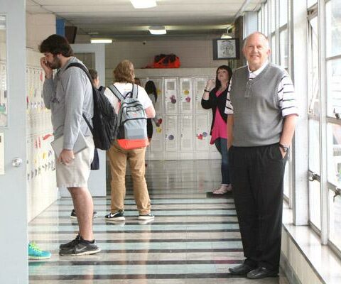 St. Joseph High School Principal Joe Mallett often greets students in the hallways between classes. Mallett, who has spent the past 36 years at the school, will resign after this school year.