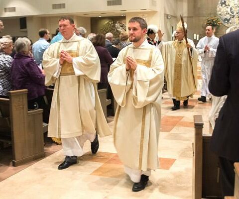 Matthew Glover and Stephen Hart process out after their diaconate ordination Mass May 25 at Christ the King Church in Little Rock. Glover is chancellor for canonical affairs and Hart is scheduled to become a priest in 2017.
