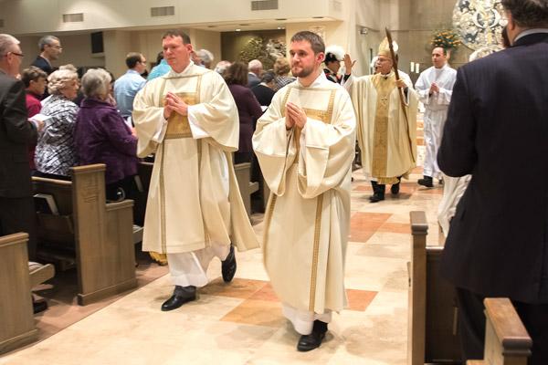 Matthew Glover and Stephen Hart process out after their diaconate ordination Mass May 25 at Christ the King Church in Little Rock. Glover is chancellor for canonical affairs and Hart is scheduled to become a priest in 2017.