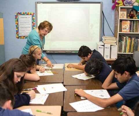 Susan Schulte, resource room specialist at Immaculate Conception School in Fort Smith, teaches comprehension technology to fifth and sixth graders Nov. 2.