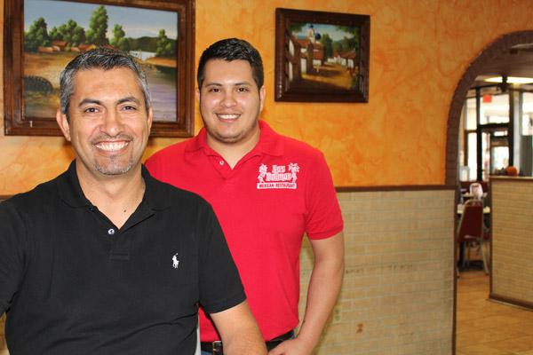 Jaime Atilano (left) and his son Edgar take a break in the North Little Rock Las Palmas. Jaime opened the Mexican restaurant in 1997 and it has since grown to four locations.