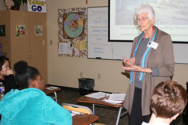 Sister Kathleen Erickson, RSM, who spent almost 20 years ministering to immigrants seeking asylum at the U.S./Mexico border, shares her experiences with senior theology students at Mount St. Mary in Little Rock Feb. 8. The students had the option to wear pajamas that day for Spirit Week.
