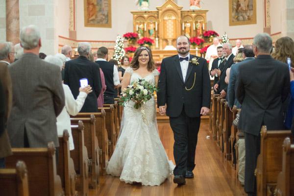 Seth and Alex Baldwin walk down the aisle after saying &lsquo;I do&rsquo; at St. Mary Church in Altus on New Year&rsquo;s Eve 2016. They said open discussion about faith and values is important. (Paxton Goates Photography)