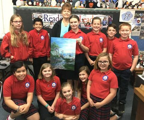 The fifth-grade class at St. John School in Russellville this year is providing artwork to brighten the walls of River Valley Christian Clinic with help from artist partners like Vicky Pacheco (standing, center).