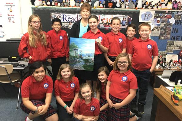 The fifth-grade class at St. John School in Russellville this year is providing artwork to brighten the walls of River Valley Christian Clinic with help from artist partners like Vicky Pacheco (standing, center).