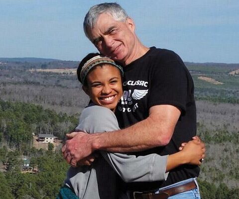 Hannah Allen hugs her father Ray on Sugar Loaf Mountain in Heber Springs during a hike last year. Hannah was adopted as a baby by Ray and Kathy Allen and met her birth mother for the first time in 2009.