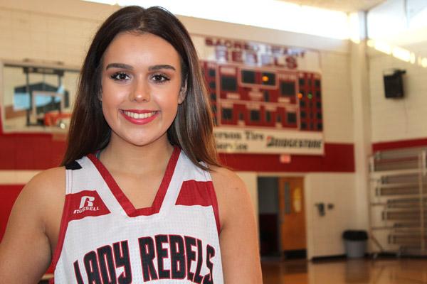 Jenna Chadek, 16, completes an early morning walk-through before first bell at Sacred Heart School in Morrilton. The junior guard came back from heart surgery last year to compete for her school.