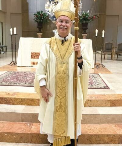 Bishop Anthony B. Taylor poses for a photo after the diaconate ordination of Jon Miskin May 23. One of the highlights of his past 10 years is ordaining 34 diocesan priests currently serving the state.