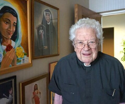 Father Thomas Keller stands by religious images in his apartment at St. John Manor in Little Rock. The 85-year-old retired priest, who served in parishes throughout Arkansas, celebrated his 60th jubilee on May 15.