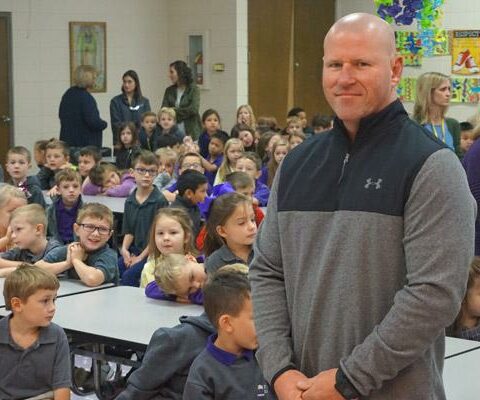 Bradley Fornash, St. Joseph School resource officer in Conway, stands among elementary students during a brief assembly Nov. 5. Fornash, retired from the Conway Police Department, was hired by the school in August.