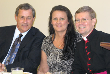 Msgr. Scott Marczuk (right) poses with his sister and brother-in-law, Tammy and Ron Smith, June 25 at McDonald Hall in Little Rock. He was ordained on the morning of June 27, 1981, and then co-officiated their wedding that afternoon. A joint reception followed that included a polka dance.