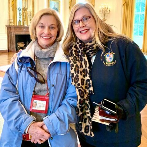 Linda Gattas (left) stands with her daughter, Beth McClinton, whom she put up for adoption 51 years ago, in the Pontifical John Paul II Institute in Washington, D.C., Jan. 23. The two women reunited just over a year ago.