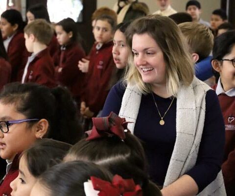 Principal Kristy Dunn circulates through the student body during a school Mass in February. The administrator of St. Theresa School in Little Rock is among five principals to receive a national award.