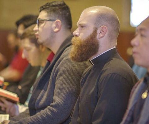 Deacon Joseph Friend prays with fellow seminarians in the chapel at St. Meinrad School of Theology in Indiana March 6.
