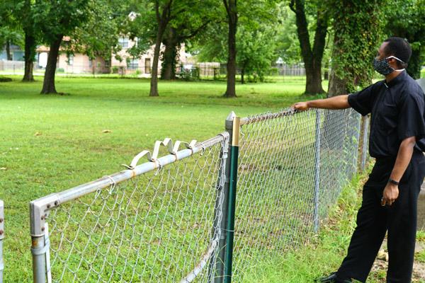 Father Leon Ngandu, SVD, pastor of St. Bartholomew Church in Little Rock, surveys the empty lot July 31 that will soon be the parish&rsquo;s Parish Life Center. (Malea Hargett photo)