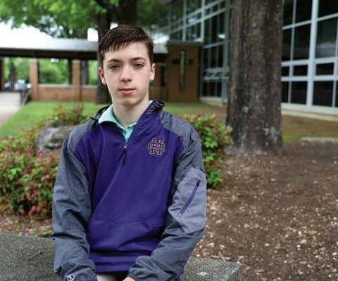 Freshman Cole Carper reports early for classes at Catholic High School in Little Rock. The teen enjoys extreme sports such as water and snow skiing and mountain biking, despite a genetic condition that limits his eyesight.