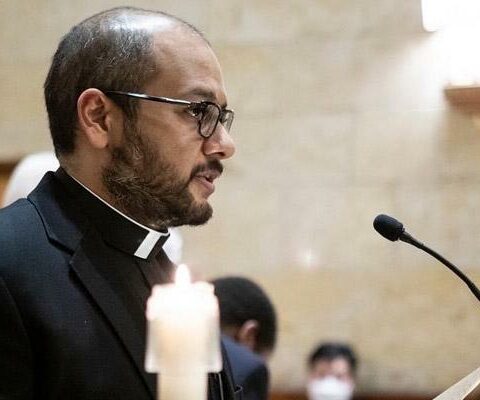 Deacon Emmanuel Torres reads his priesthood promises during a service at St. Meinrad Seminary in Indiana March 16.