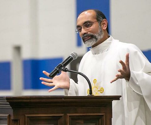 Father John Antony, who celebrated his 25th anniversary as a priest on Pentecost May 23, gives a homily during the eighth-grade Trinity Junior High School graduation May 18 in Fort Smith.