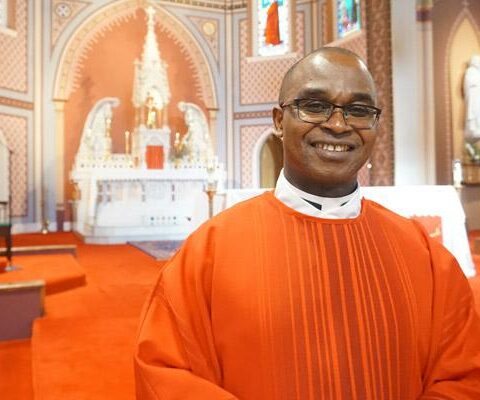 Father James Ibeh, CSSp, 55, smiles at the Cathedral of St. Andrew following the Jubilee Mass June 29. He is celebrating his 25th jubilee Aug. 10.