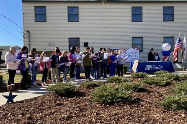 The Christ the King School choir sings at Fort Smith's Veterans' Day Parade at Chaffee Crossing Nov. 13.