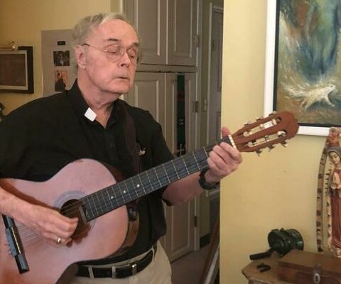 Father Ed Graves, a senior priest in the Diocese of Little Rock, lives at St. John Manor on the campus of the St. John Center in Little Rock. Fond of music and art, Father Graves, seen here Dec. 1, can usually be found drawing, painting or playing songs by Elvis Presley on his guitar.