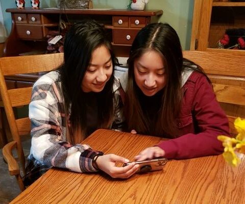 Erica and Emily Verkamp of Charleston FaceTime with their Guatemalan birth family in December. They located their birth mother and siblings in December 2020.
