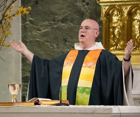 Franciscan Father Tom Gallagher, pastor of St. Francis of Assisi Church in New York City, prays during an annual "Pre-Pride Festive Mass" June 26, 2021. The liturgy, hosted by the parish's LGBT Ministry, is traditionally celebrated on the eve of the city's Pride march for the LGBTQ+ community.